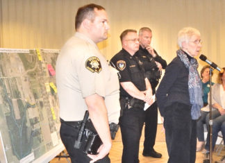 Homeless in Washington County From left, Dave Shook from the Washington County Sheriff’s Office, Neil Charlton from the Tigard Police Department, Pat Dean from the King City Police Department and Carol Herron with the St. Anthony severe weather shelter listen to an audience member’s question at the March 19 joint meeting of Citizen Participation Organizations 4K (King City) and 4B (Bull Mountain/Tigard).