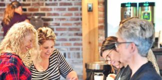 Volunteers Fill Backpacks for Intern’s First Day of Work