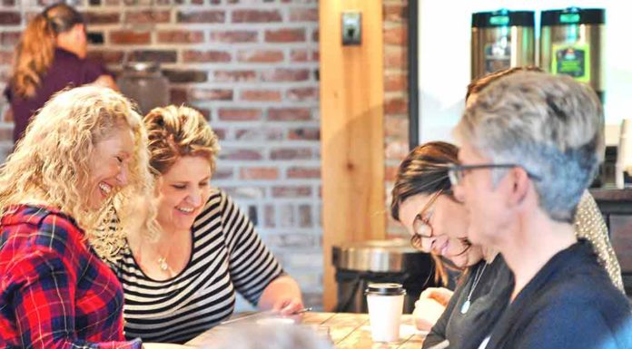 Volunteers Fill Backpacks for Intern’s First Day of Work