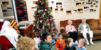 Inter-generational daycare brings seniors and children together A Gentog staff member (center) leads a lesson in sign language to both seniors and pre-kindergartners at the inter-generational daycare that features daily interactions between the two groups.