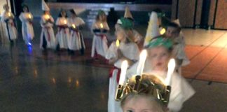 Kindergartners learn about different December traditions and cultures St. Lucia procession.