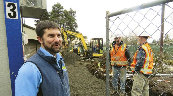 King City Urban Growth Boundary takes shape King City Manager Mike Weston chats with a city employee in the police parking lot while in the background, City Hall is undergoing a total transformation with construction slated to be completed in April.