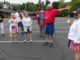 King City Residents Hold Independence Day Parade, Honors 2020 Graduates and First Responders King City parade organizer Louis Martinez (in the red shirt) explains to parade participants the route they will take around the Golf Course.