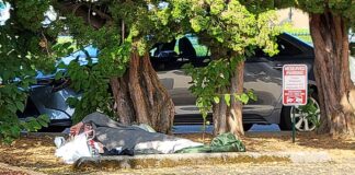 Downtown Tigard the epicenter of local homelessness A homeless person sleeps in a downtown Tigard parking lot.