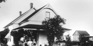 Dr. Sylvester (seated) with his second wife, Elizabeth, and two sons, George and Arthur, at their home at the intersection of McDonald and 102nd. Dr.