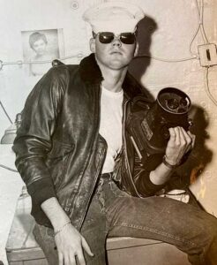 Larry Jensen poses in the flight jacket and sunglasses he will wear during a photo reconnaissance flight.
