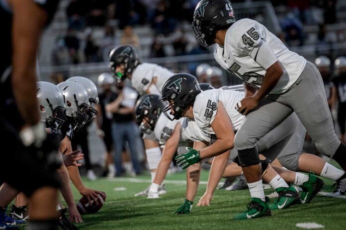 Tigard’s defensive line sets up against Mountainside in their first win of the season on Sept. 19.