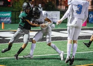 Tigard’s AJ Perez (11) constrains Lakeridge wide receiver Lucas Burkeen (11) to the 2-yard line prior to the Pacers’ initial score. 