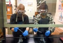 Tigard High chemistry teacher Kelsey Wahl has her students in the fume hood performing labs.