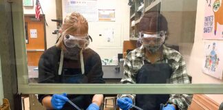 Tigard High chemistry teacher Kelsey Wahl has her students in the fume hood performing labs.