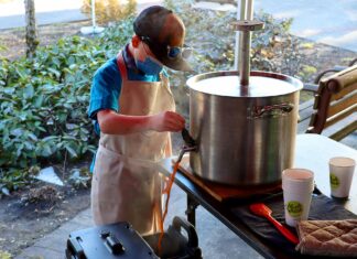Young Philanthropist Brews Big Benefit to Fight Hunger Cooper pouring coffee from Nossa Familia’s giant, custom welded French Press at a Feb.12 Cooper’s Coffee pop-up outside of Meals On Wheels People at the Tigard Senior Center.