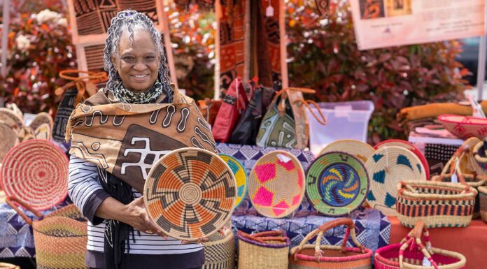 Happenings at the Farmers Market Haoua Cheick displaying a few of the woven basket designs available for purchase at the Bull Mountain Farmers Market each weekend.