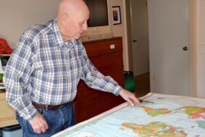 Roland Whitely purchased a huge Rand-McNally map after he joined the Navy.