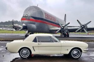Two famous modes of transportation sit next to each other at the Tillamook Air Museum - the 1964-1/2 Ford Mustang and Erickson Air Crane’s Mini Guppy.