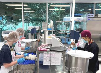 Tigard Milk Bank nourishes infants across the Northwest Members of the milk bank’s processing team dispense donor milk into bottles as part of the pasteurization process.