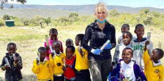 Tualatin dentist Dr. Julie Spaniel with students at Gilisho Freedom Academy school in Kenya.