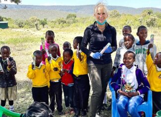 One World Brigades building school and community center in Kenya Tualatin dentist Dr. Julie Spaniel with students at Gilisho Freedom Academy school in Kenya.