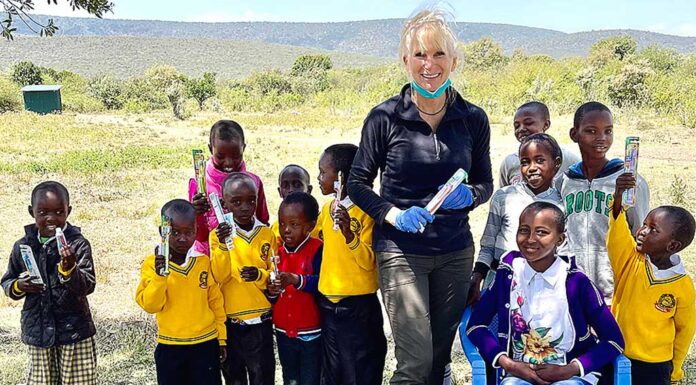 One World Brigades building school and community center in Kenya Tualatin dentist Dr. Julie Spaniel with students at Gilisho Freedom Academy school in Kenya.