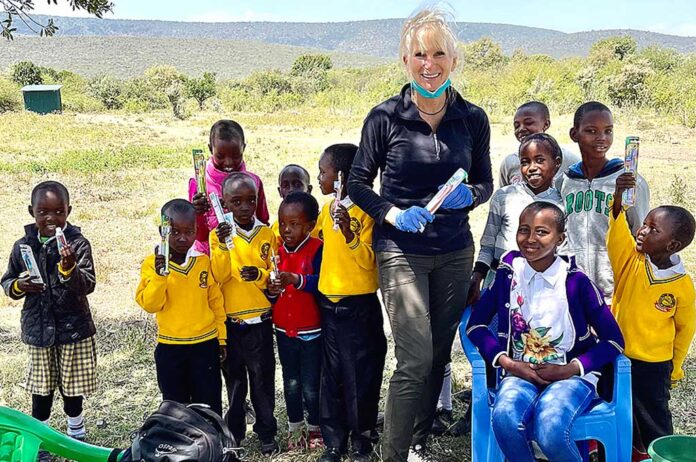 Tualatin dentist Dr. Julie Spaniel with students at Gilisho Freedom Academy school in Kenya.
