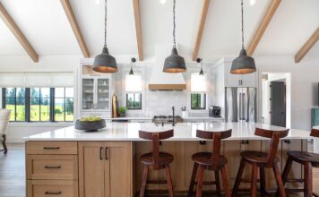 Add Personality to your Home this Year This modern farmhouse kitchen mixes painted cabinets with a rift-sawn white oak island.