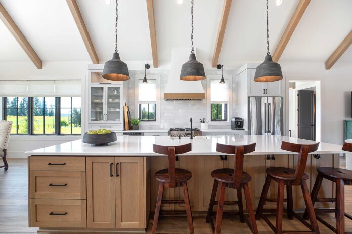 This modern farmhouse kitchen mixes painted cabinets with a rift-sawn white oak island.