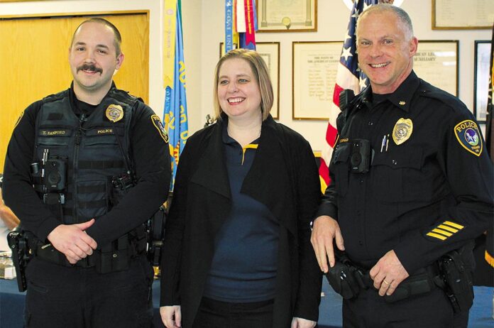 Tigard American Legion Post 158 Firefighter of the Year Tyler Sanford (left) stands with Post Commander Allyson Kropf and Tigard Police Commander Jamey McDonald.