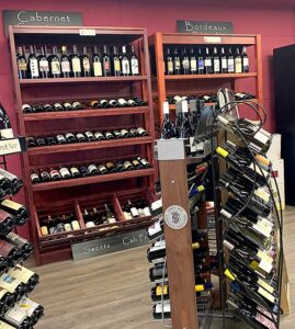 Sip D’ Vine offers full and half case discounts, and a fridge is fully stocked with whites, dry rosés, and bubbles if you need to grab something on the way. 