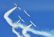 The Missing-Man Maneuver Flyover will be performed by the West Coast Ravens RV Formation Team.