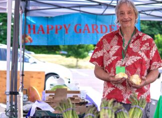 Happy Gardens Nursery – Todd Symes Happy Gardens’ Todd Symes holding a couple of large cauliflower mushrooms.