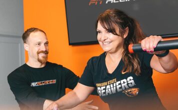 Fat Loss Secrets for Women Over 40 – Part 1 Jordon Hice (left) assists Michelle on a multi-hip machine.
