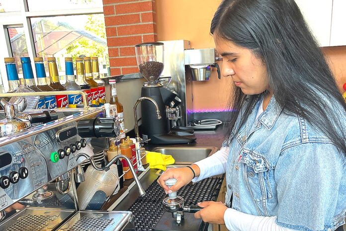 Chilita’s owner, Michelle Cruz, polishes her barista skills. She’s looking forward to serving seasonal specials, like Tamales, and introducing Bubble Waffles and milkshakes to her menu.