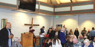 Crowd delivers strong message against homeless staying in cars at church overnight