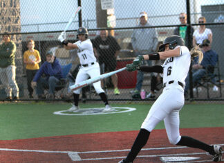 Tigard softball opens league play with road win