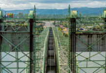 WA and Oregon scale back I-5 bridge ambitions as cost balloons to $14.4B Crews work on the Interstate 5 bridge over the Columbia River in 2019. (Oregon Department of Transportation)