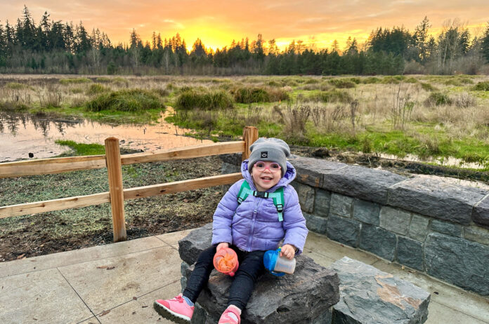Stephen Alexander’s daughter, Morgan, takes in the sunset at Cook Park, a beautiful place to learn about science writing.