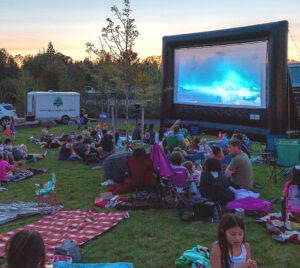Residents arrive with lawn chairs at last summer's Movie Night at Universal Plaza.