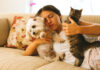 New Puppy or Kitten? Start Off on the Right Foot Woman on couch with pets