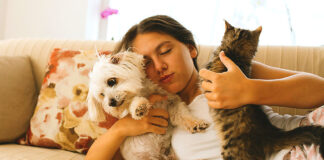 New Puppy or Kitten? Start Off on the Right Foot Woman on couch with pets