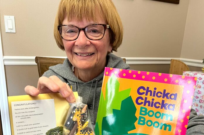Diane Bonica, who retired from teaching kindergarten in 2014, shows elements of packages she is giving to that year’s class of students as they now graduate from high school. It is her last of 28 years of fulfilling her annual gift tradition.