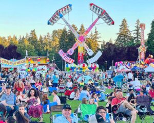 A crowd in front of the Tigard Festival of Balloons Carnival.