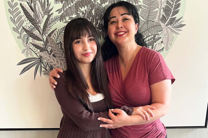 Sarah Farhangi holds her mom, Frouz Farhang (slightly different spelling), at a Starbucks in Tigard. Sarah credits her mother for her inspiration and independence in seriously pursuing a career on the musical stage.