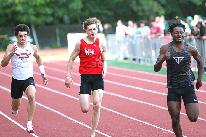 Tigard’s Marcus Burton (right), seen at the Three Rivers League meet, captured the 200 meter state title to wrap up an impressive senior season.
