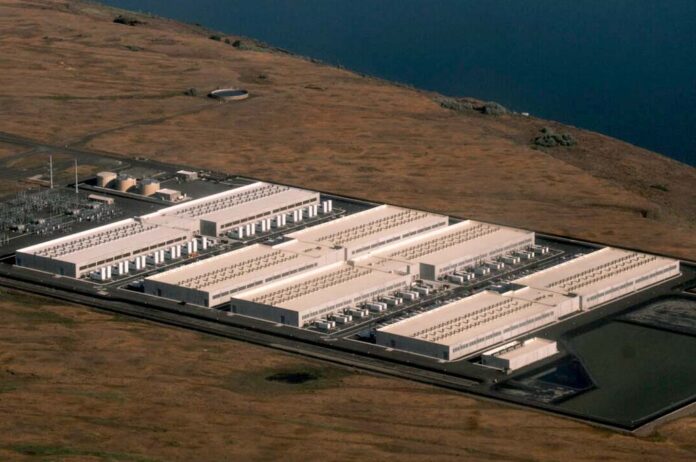 Umatilla-County-Datacenter An explosion of data center facilities, including the one pictured here in Umatilla County on May 18, 2026, have been built in Oregon along the Columbia River Gorge during the last few years. The boom has caused a more than 500% load growth for the Umatilla Electric Cooperative during the last decade, which has had to buy more gas and coal-powered electricity on the wholesale market to meet demand.