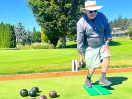 Lawn bowling: ‘What cheap entertainment’ Raymond Francis, coach-administrator of the King City Lawn Bowling Club, demonstrates his bowling form one recent morning on the bowling green of the King City Civic Association.