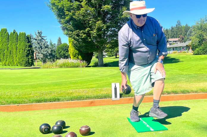 Lawn-Bowling Raymond Francis, coach-administrator of the King City Lawn Bowling Club, demonstrates his bowling form one recent morning on the bowling green of the King City Civic Association.