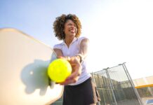 Staying Active After 40: How to Prevent Exercise Injuries A woman playing pickleball