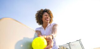 Staying Active After 40: How to Prevent Exercise Injuries A woman playing pickleball