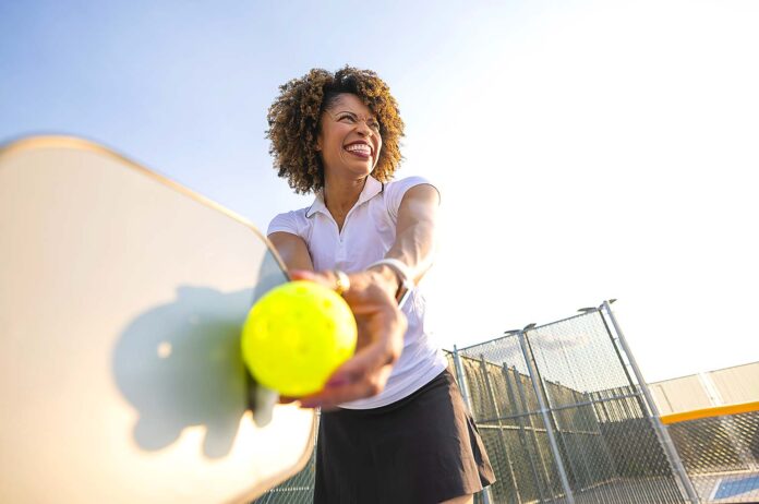Staying-active-with-pickleball A woman playing pickleball