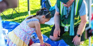 Tigard CERT: Preparedness Starts with Community A child learning CPR at Tigard CERT Fair