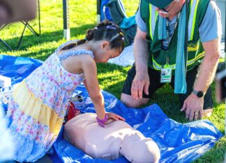 Tigard CERT: Preparedness Starts with Community A child learning CPR at Tigard CERT Fair